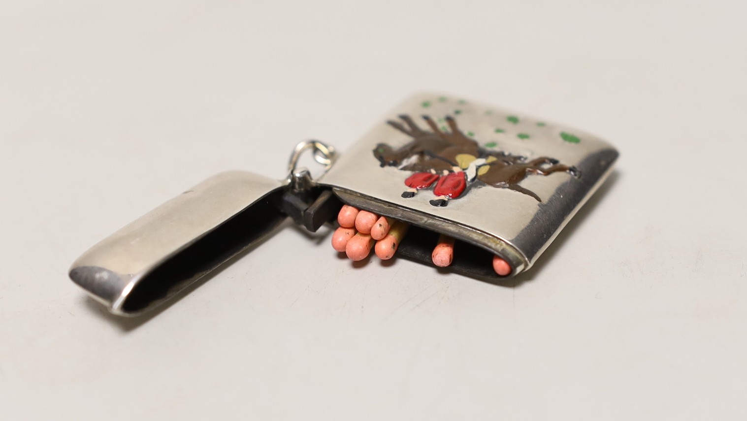 A sterling 925 and enamelled vesta case, depicting a hunting scene, 48mm.